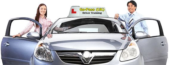 Image of a driving instructor, with a pupil, both stood by the Go-Pass (UK) tuition vehicle.